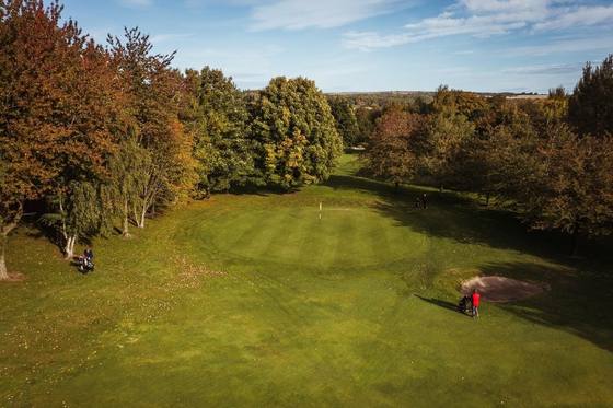 An aerial view of an autumn-coloured green at Beamish Park Golf Club