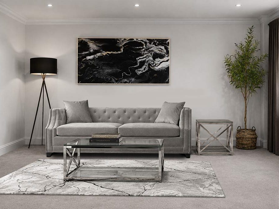 Grey chesterfield sofa living room with black marble artwork and mirrored coffee table