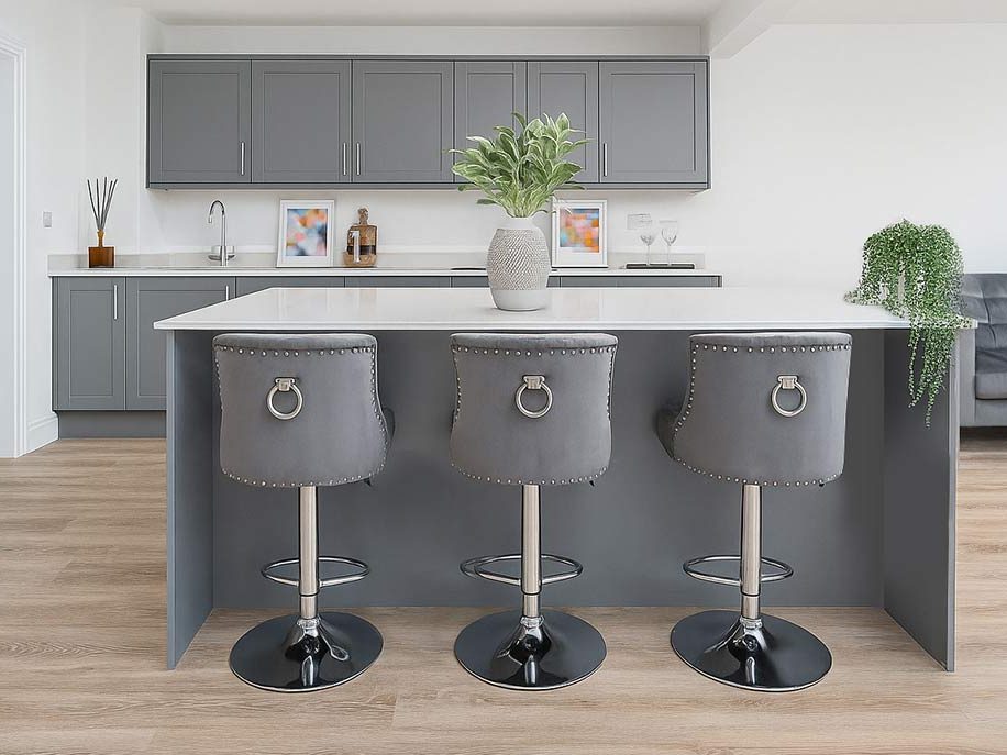 Kitchen island with grey studded bar stools, ready for launch