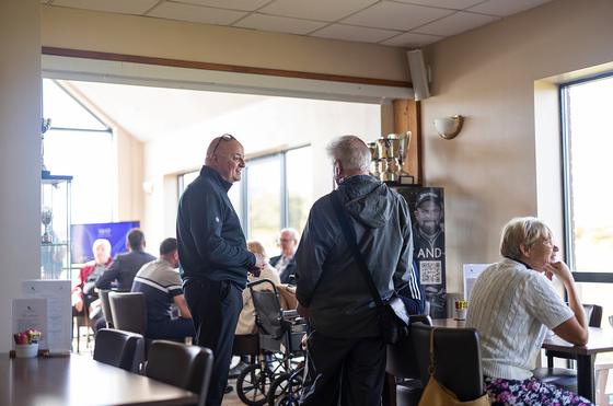 Guests chatting together in the clubhouse